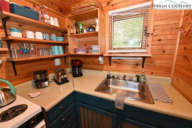 a bedroom with a bed and a mirror