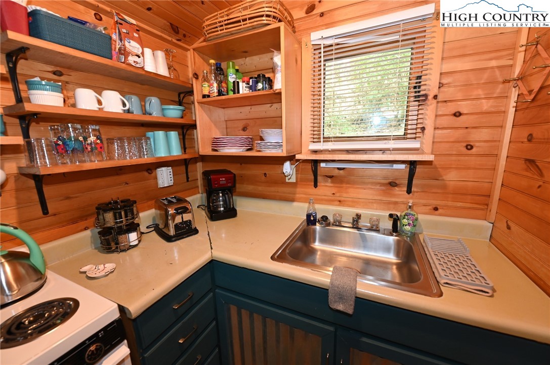 3430-3390 Rose Creek Road Morganton, NC 28655 - Photo 47 of 50 a kitchen with a sink a stove and cabinets
