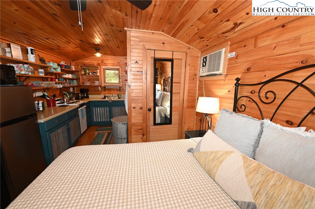 3430-3390 Rose Creek Road Morganton, NC 28655 - Photo 48 of 50 a bedroom with a bed and a mirror