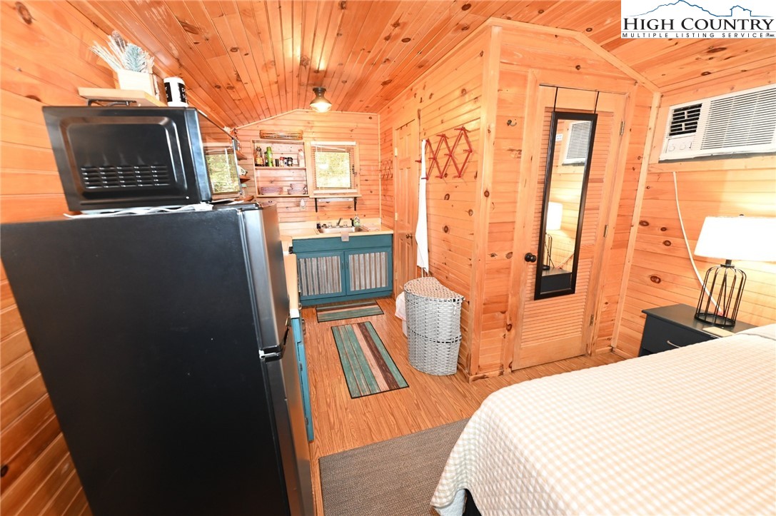 3430-3390 Rose Creek Road Morganton, NC 28655 - Photo 49 of 50 a bed room with a bed and wooden floor