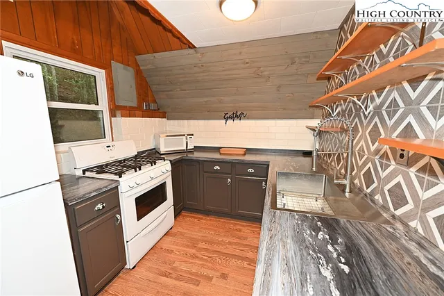 a kitchen with a stove and a microwave