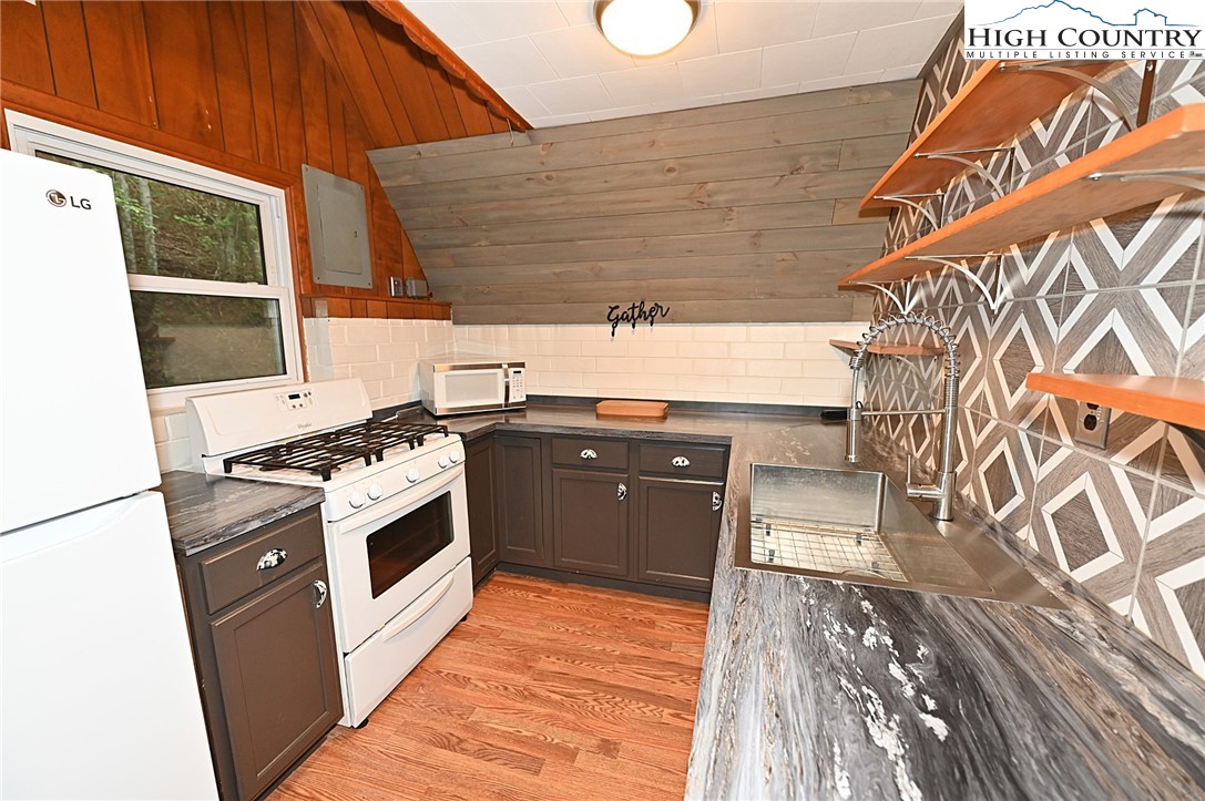 3430-3390 Rose Creek Road Morganton, NC 28655 - Photo 7 of 50 a kitchen with a stove and a microwave