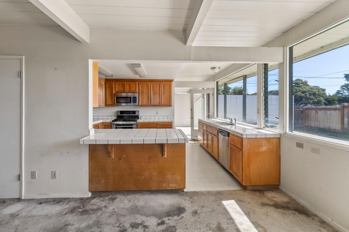 220 Mortimer Lane Marina, CA 93933 - Photo 16 of 42 a kitchen with stainless steel appliances granite countertop a stove and a refrigerator