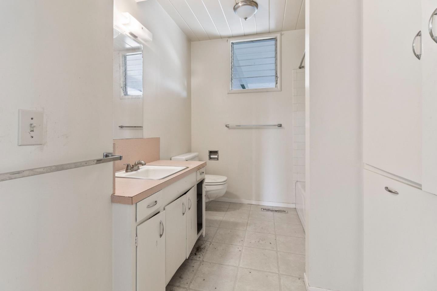 220 Mortimer Lane Marina, CA 93933 - Photo 20 of 42 a bathroom with a sink toilet and vanity