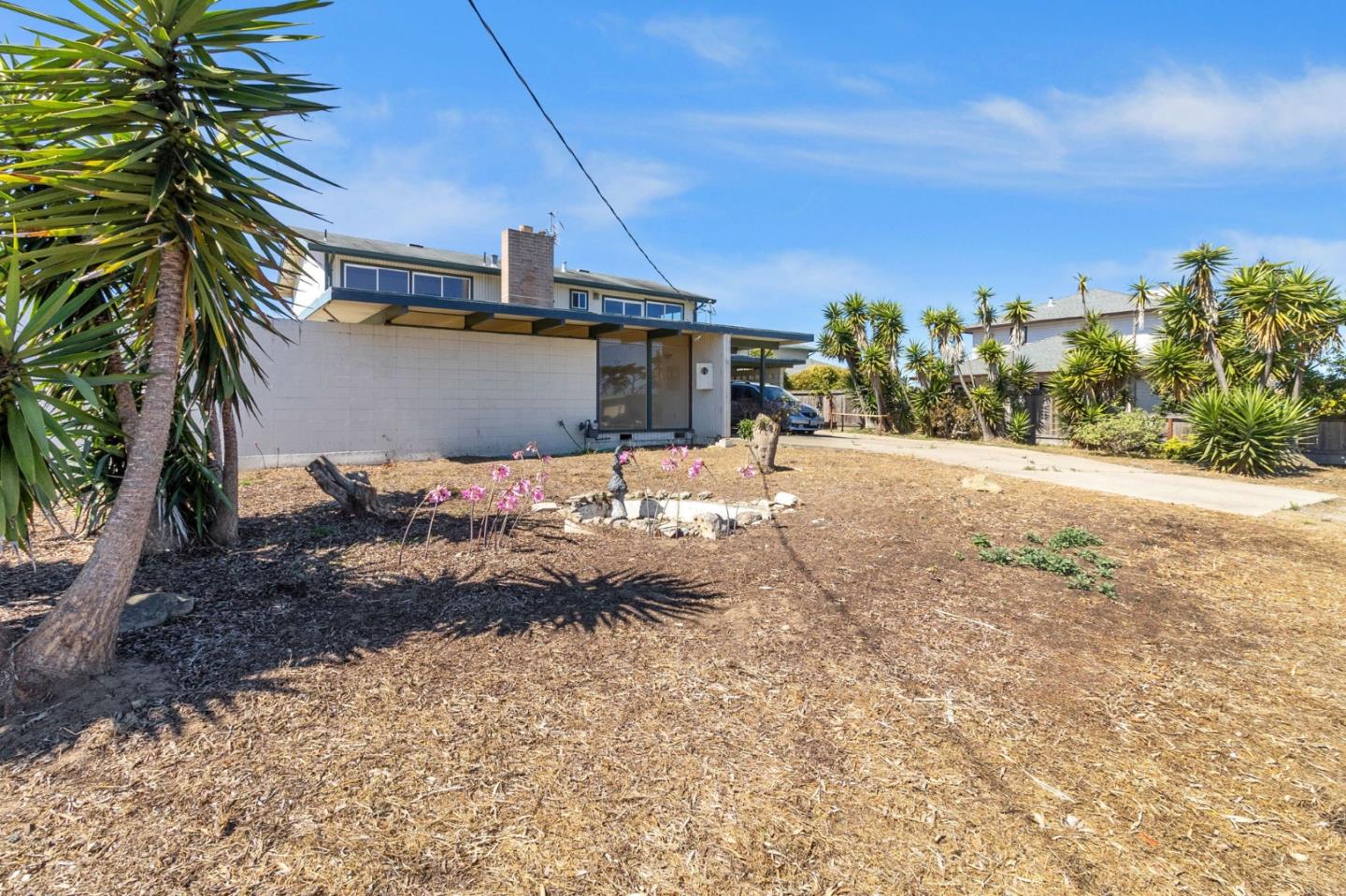 220 Mortimer Lane Marina, CA 93933 - Photo 2 of 42 a backyard of a house with table and chairs