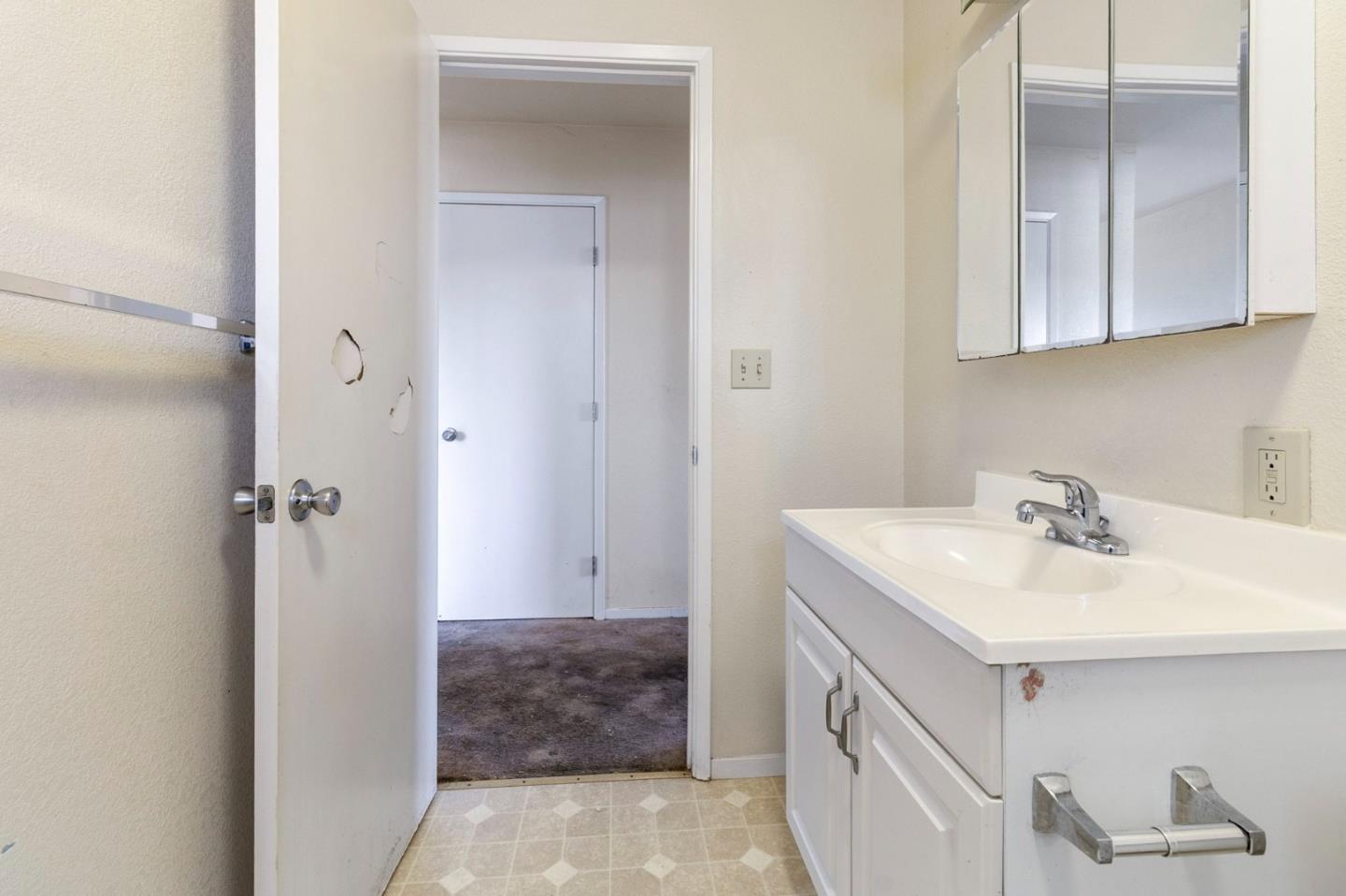 220 Mortimer Lane Marina, CA 93933 - Photo 31 of 42 a bathroom with a sink and a mirror