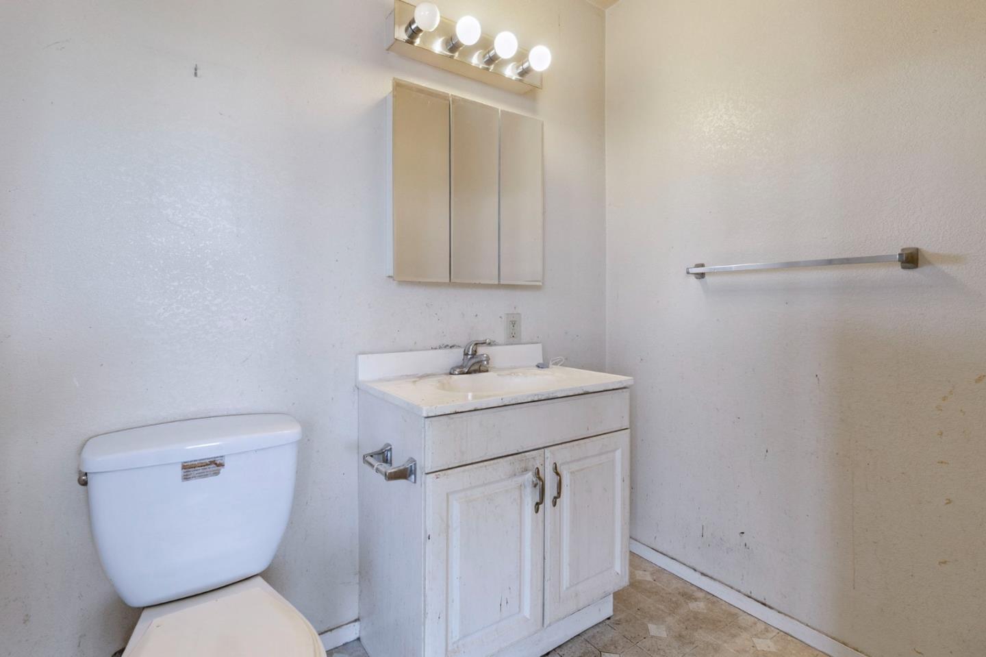 220 Mortimer Lane Marina, CA 93933 - Photo 36 of 42 a bathroom with a toilet sink and mirror