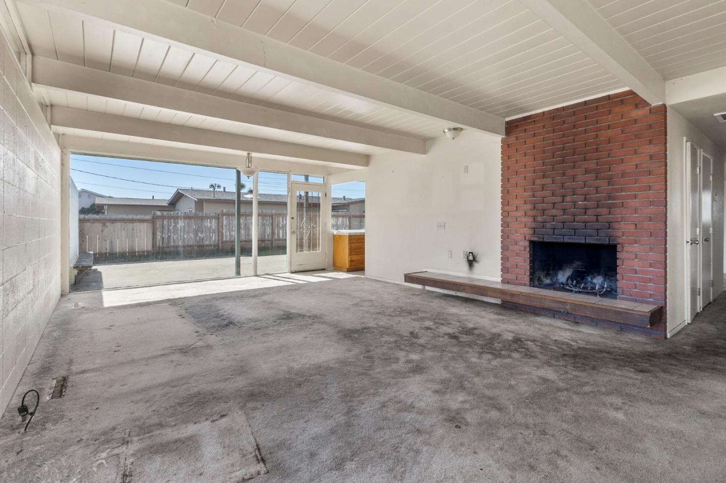 220 Mortimer Lane Marina, CA 93933 - Photo 8 of 42 a view of an empty room with a fireplace