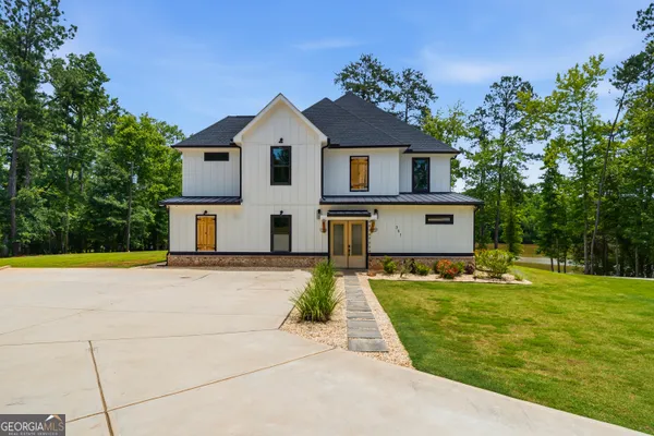 a front view of a house with a yard