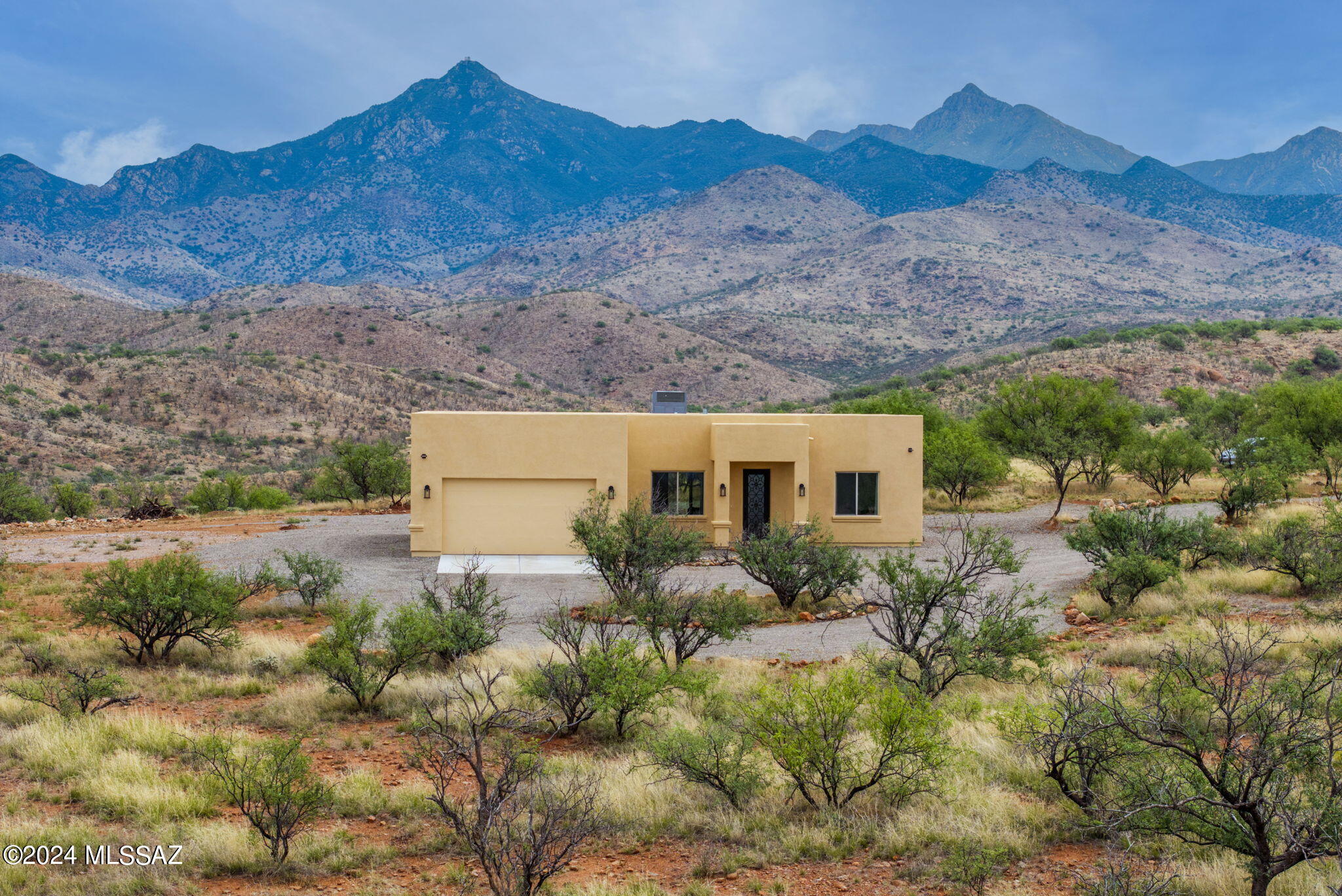 22 Vigas Lane Rio Rico, AZ 85648 - Photo 1 of 40 a view of a house with a yard and plants