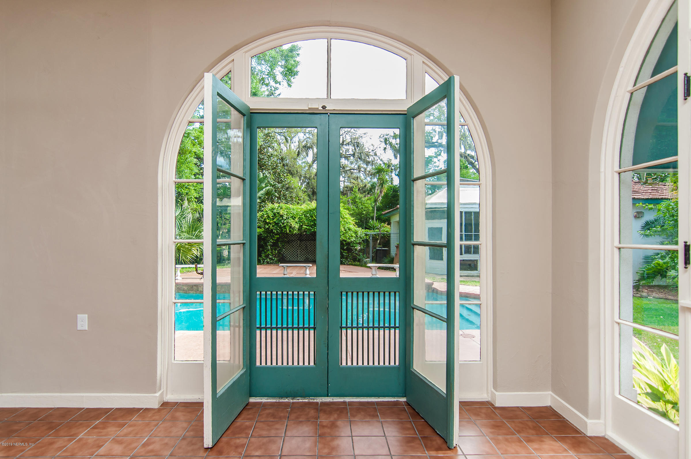 39 Valencia Street St. Augustine, FL 32084 - Photo 12 of 58 a view of an entryway with a floor to ceiling window