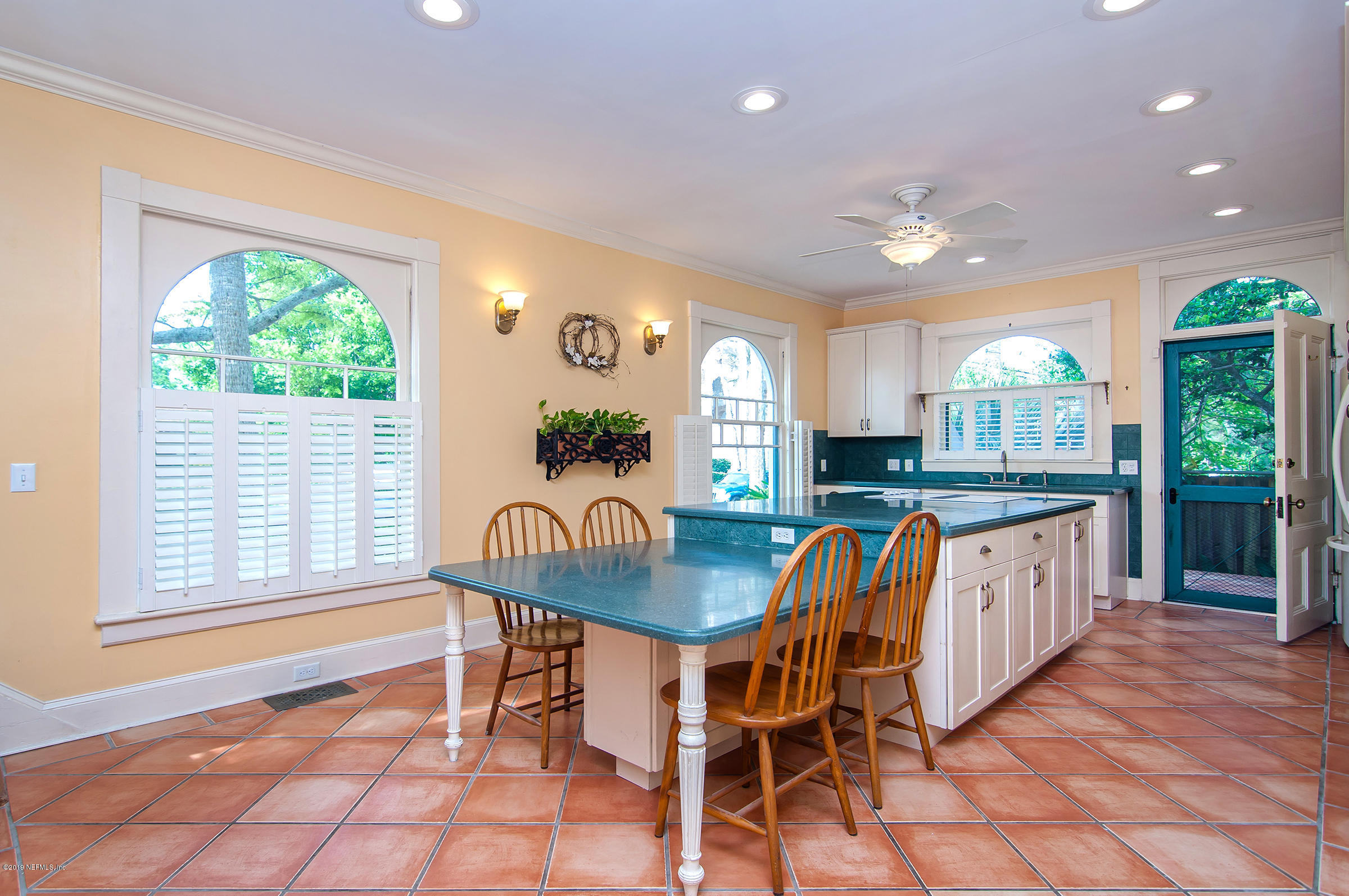 39 Valencia Street St. Augustine, FL 32084 - Photo 15 of 58 a dining room with furniture and a large window