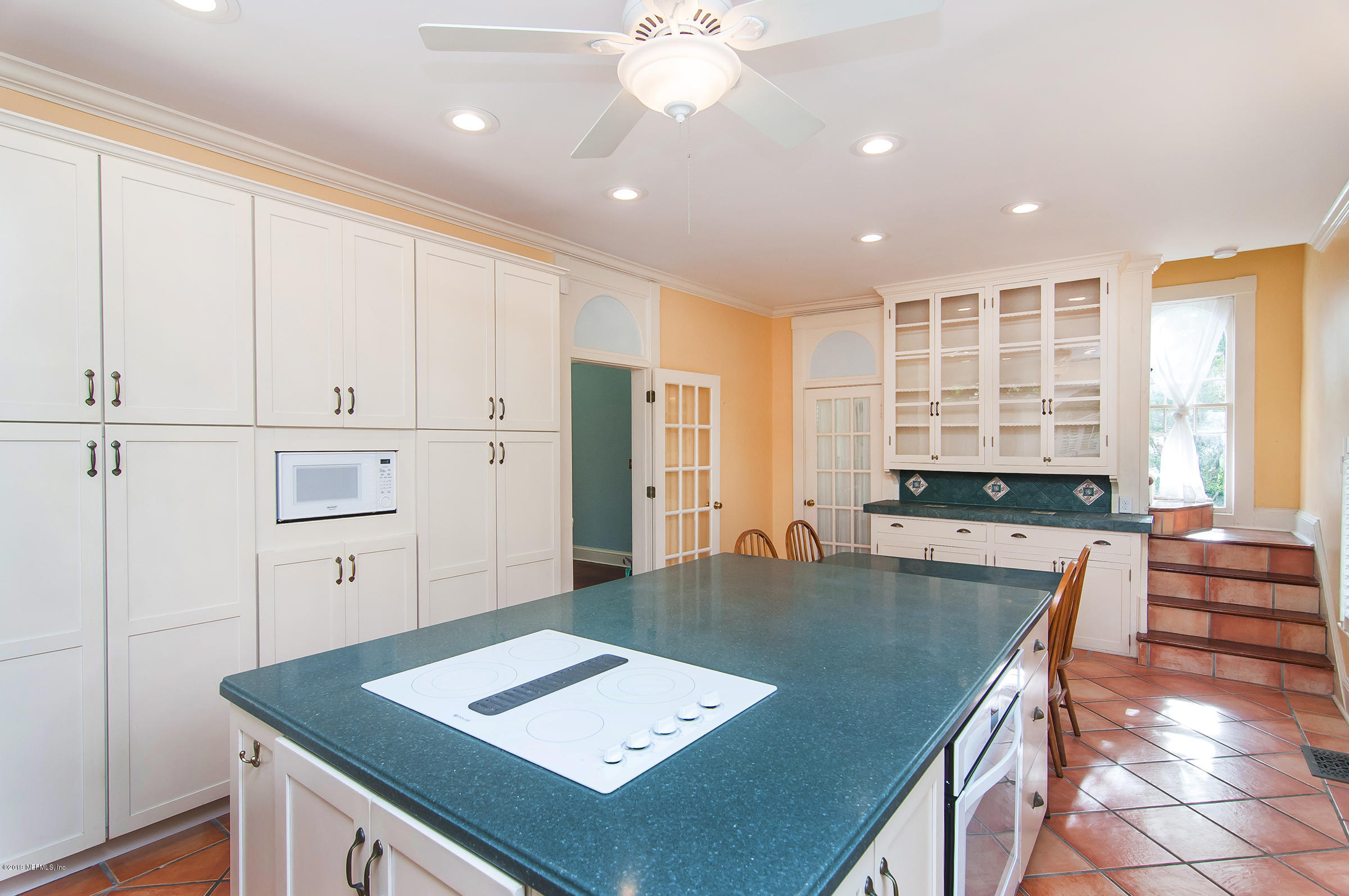 39 Valencia Street St. Augustine, FL 32084 - Photo 18 of 58 a view of a kitchen with kitchen island a counter top space appliances and cabinets