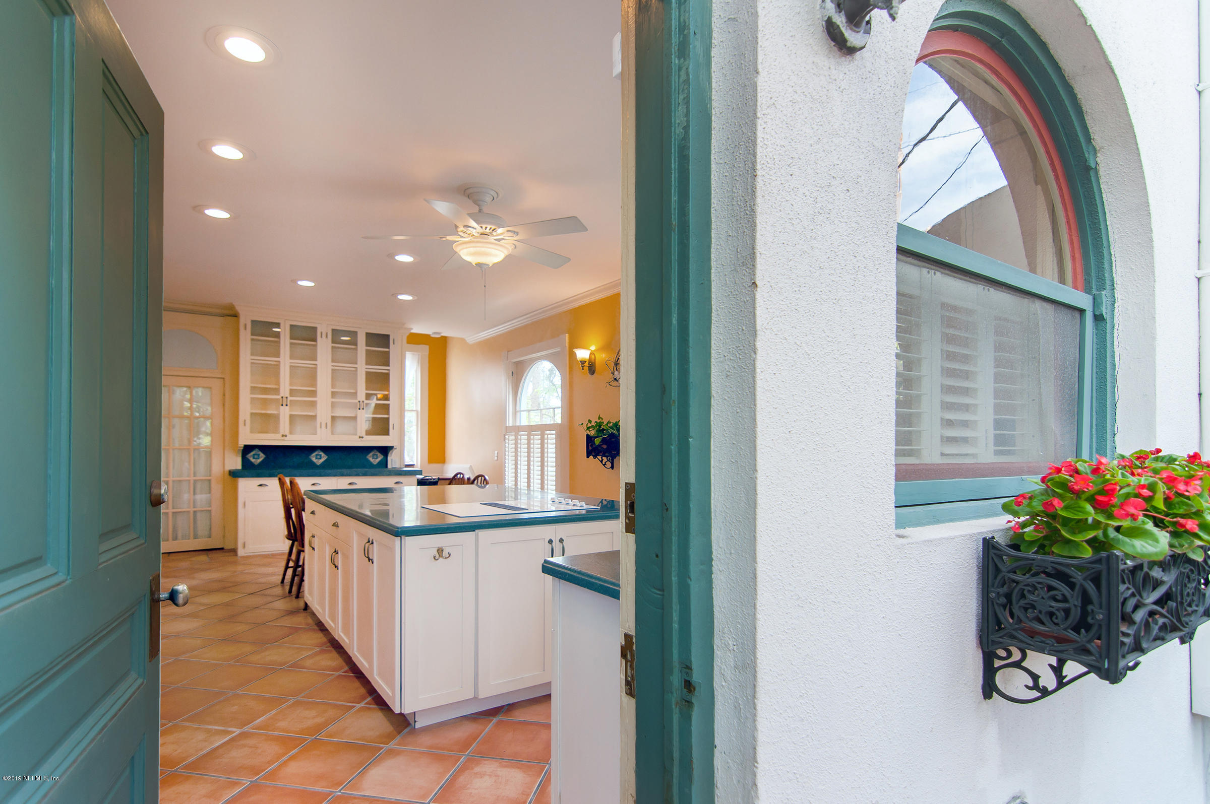 39 Valencia Street St. Augustine, FL 32084 - Photo 23 of 58 a kitchen with stainless steel appliances granite countertop a sink and a stove