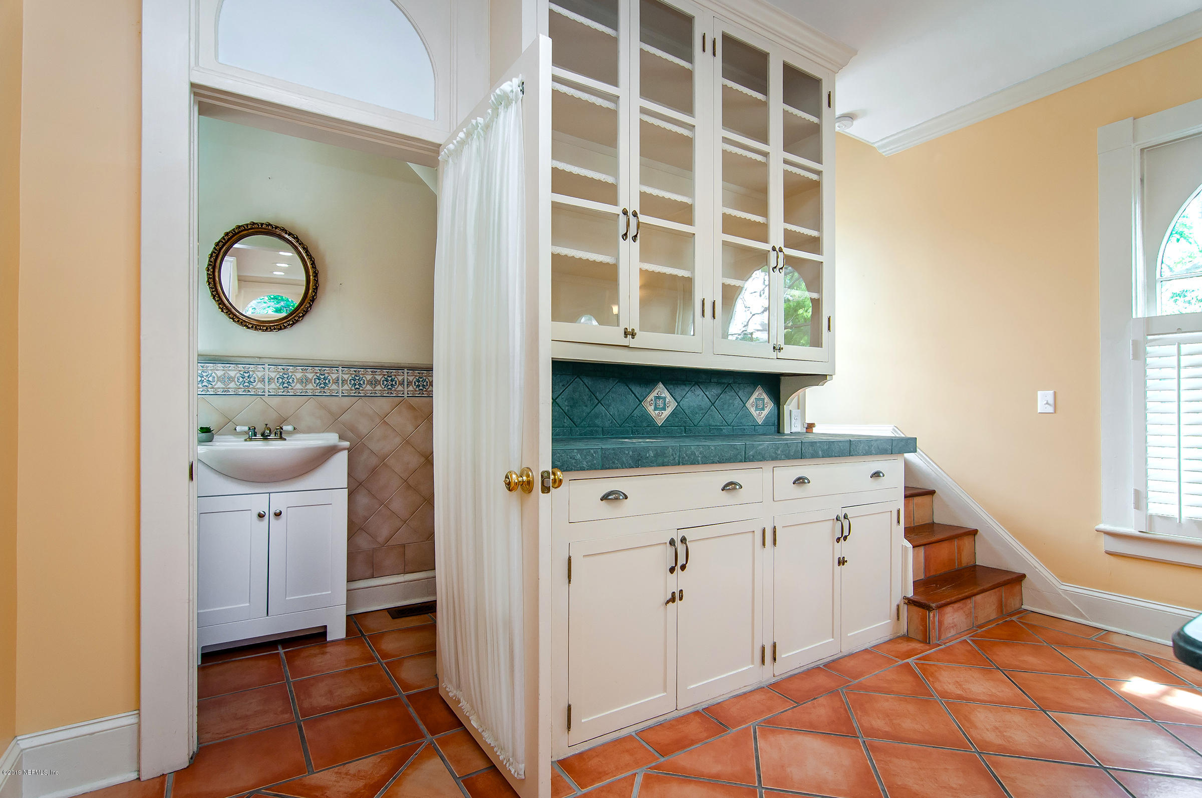 39 Valencia Street St. Augustine, FL 32084 - Photo 24 of 58 a view of cabinets with wooden floor and windows
