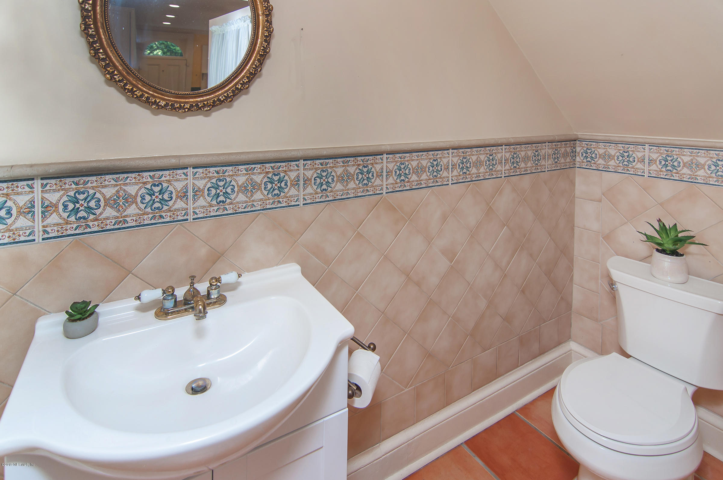 39 Valencia Street St. Augustine, FL 32084 - Photo 25 of 58 a bathroom with a sink and a mirror