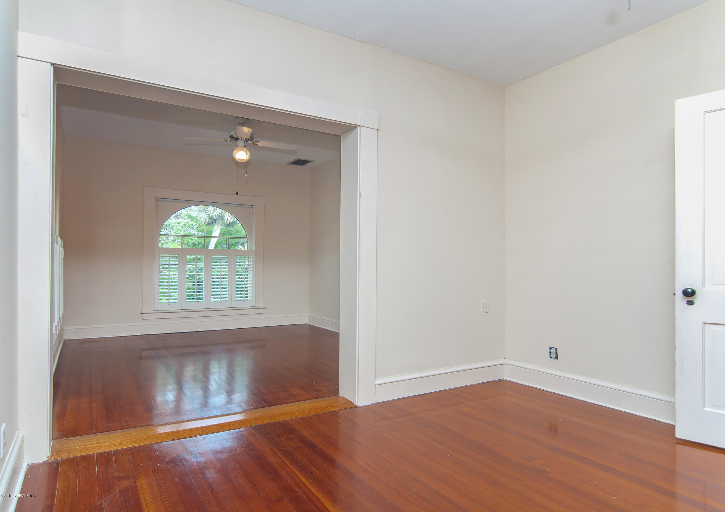 39 Valencia Street St. Augustine, FL 32084 - Photo 30 of 58 an empty room with wooden floor and windows