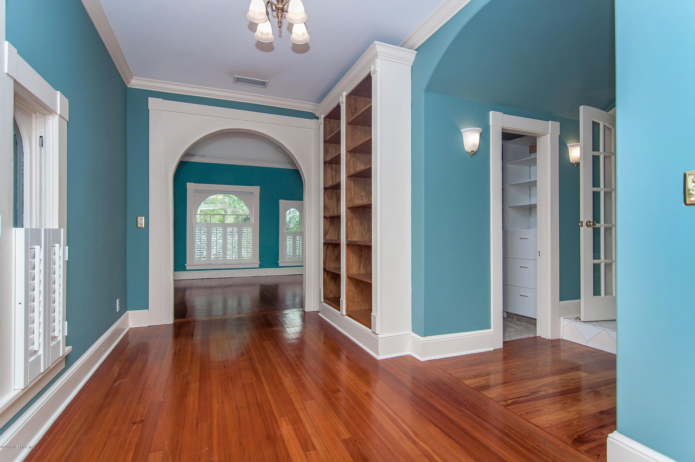 39 Valencia Street St. Augustine, FL 32084 - Photo 35 of 58 a view of livingroom with floor to ceiling window and wooden floor