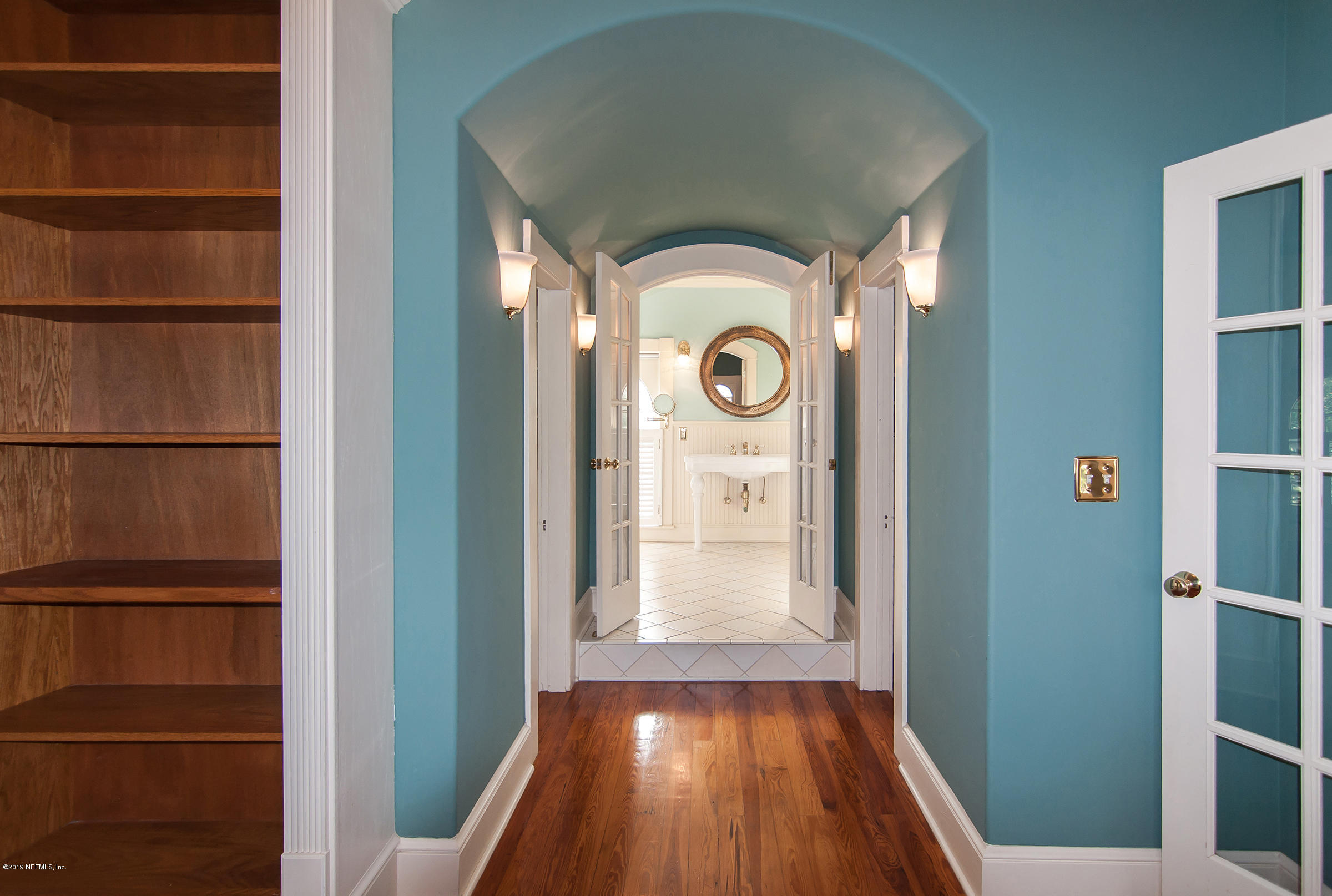 39 Valencia Street St. Augustine, FL 32084 - Photo 36 of 58 a view of walk in closet with wooden floor