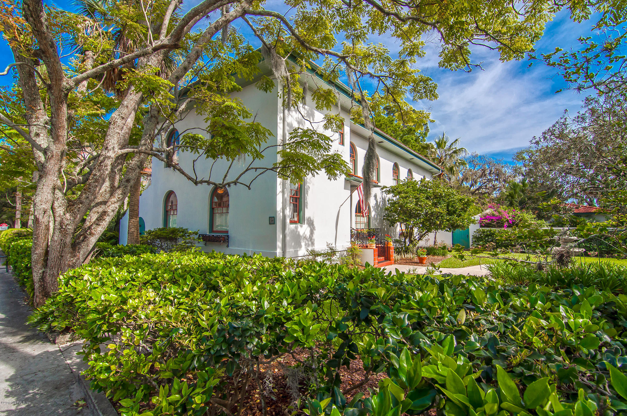 39 Valencia Street St. Augustine, FL 32084 - Photo 55 of 58 a backyard of a house with lots of green space