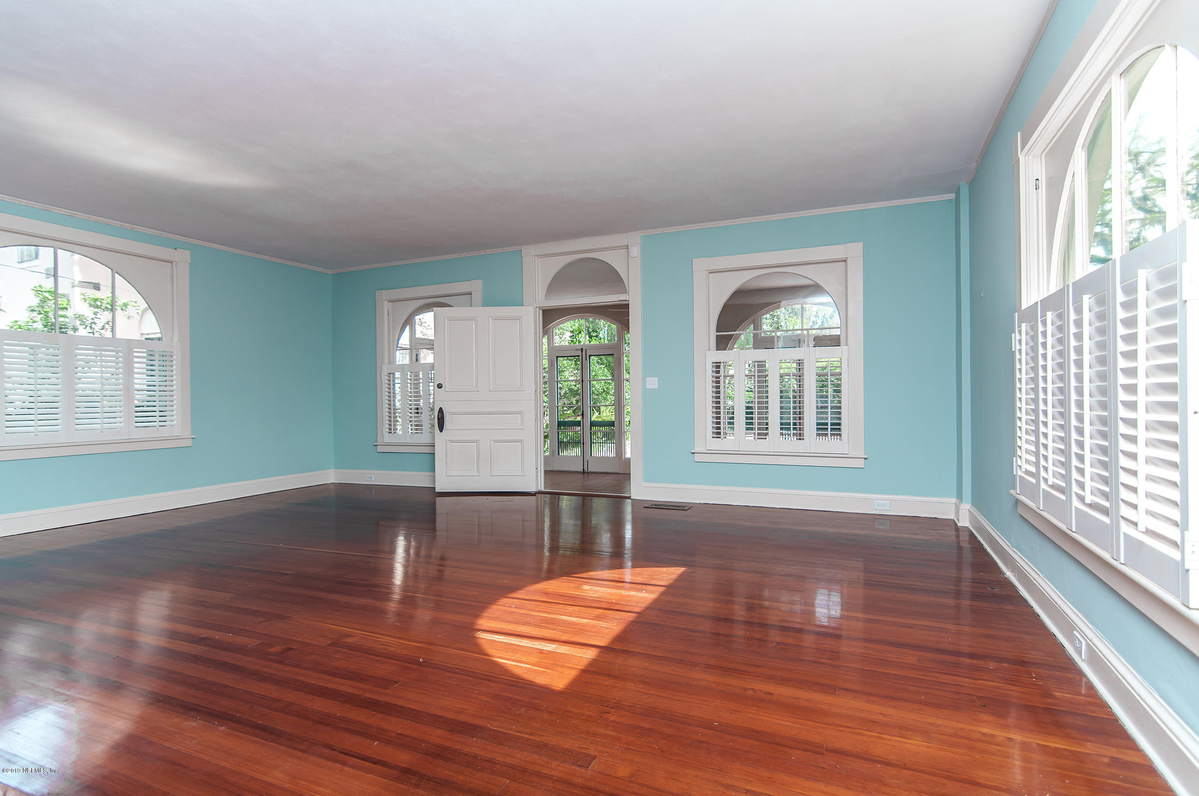39 Valencia Street St. Augustine, FL 32084 - Photo 9 of 58 a view of empty room with wooden floor and fan