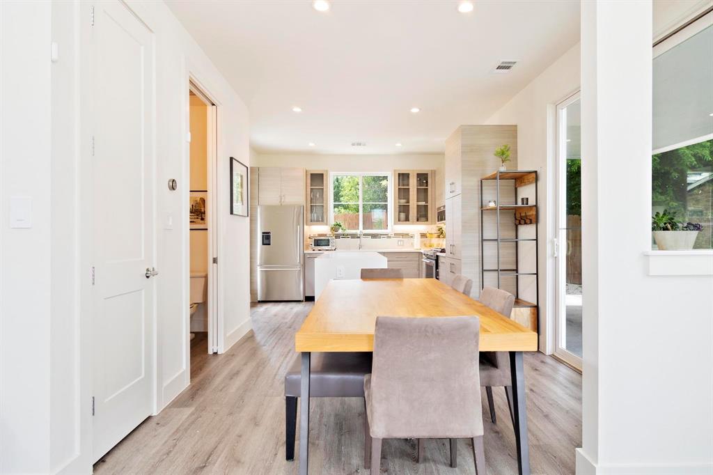 911 Stobaugh Street, Unit 2 Austin, TX 78757 - Photo 9 of 26 Open-concept living area with wood-finish flooring, recessed lighting, and white trim