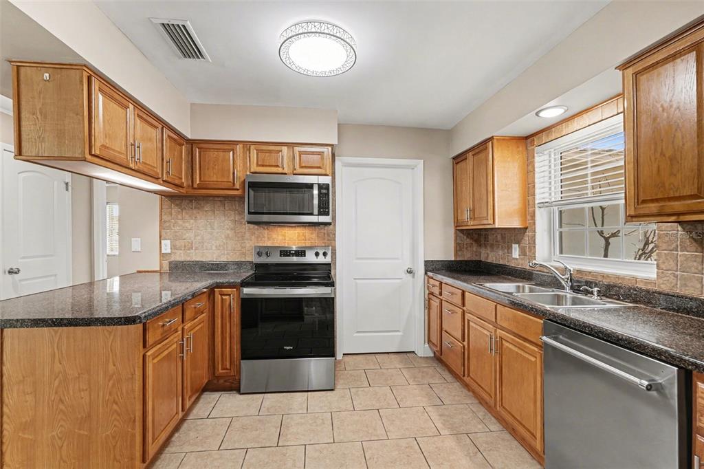1338 Pilgrim Road Spring Hill, FL 34606 - Photo 6 of 26 Gallery Image 6