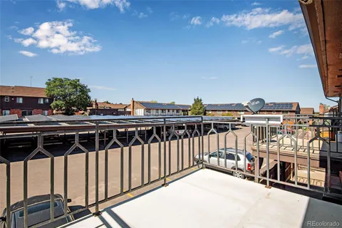 a view of a balcony with chairs