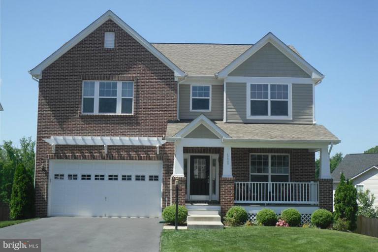 4229 Meyers Road Triangle, VA 22172 - Photo 1 of 29 front view of a house with a yard