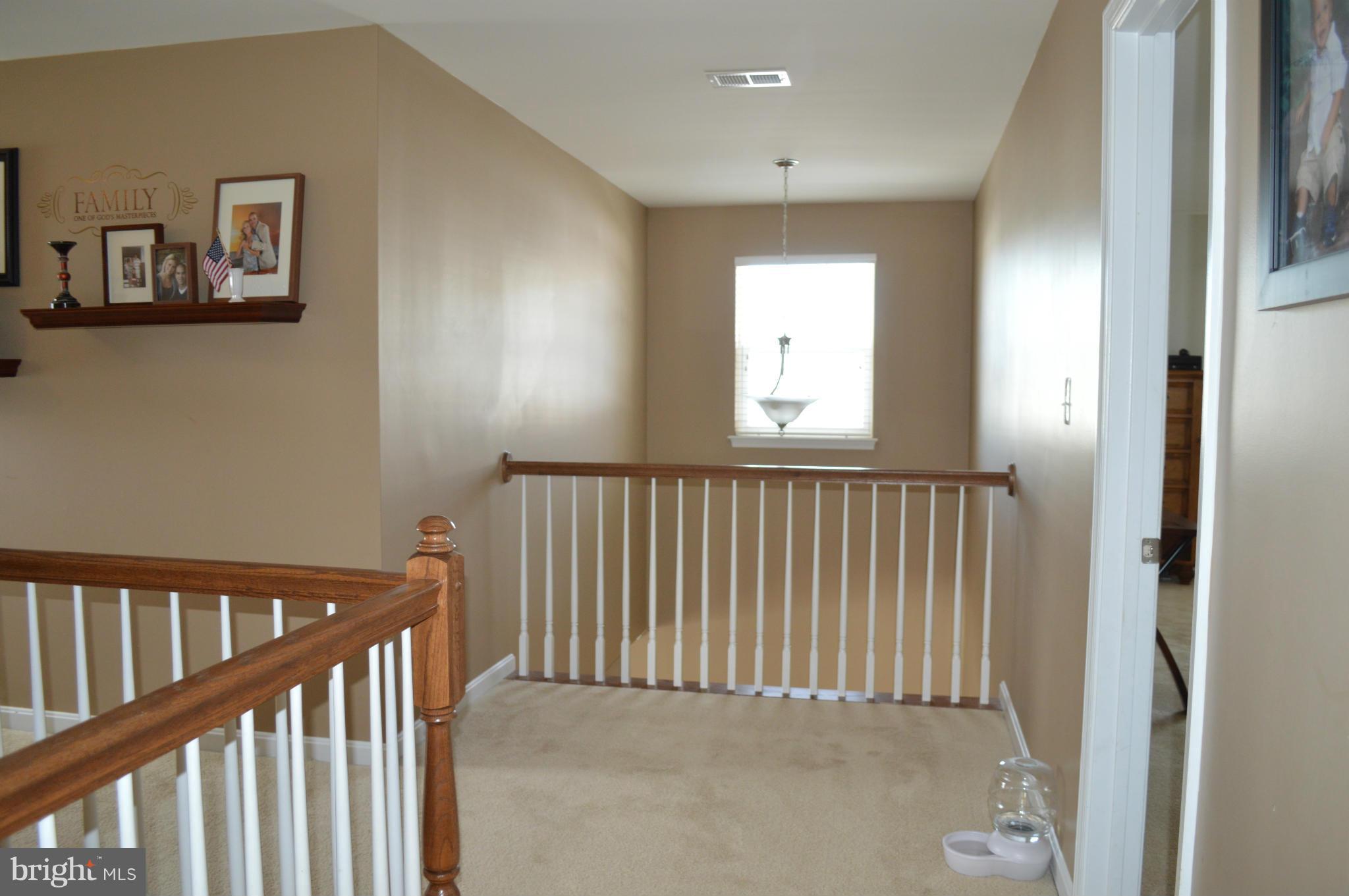 4229 Meyers Road Triangle, VA 22172 - Photo 12 of 29 a view of a hallway with windows