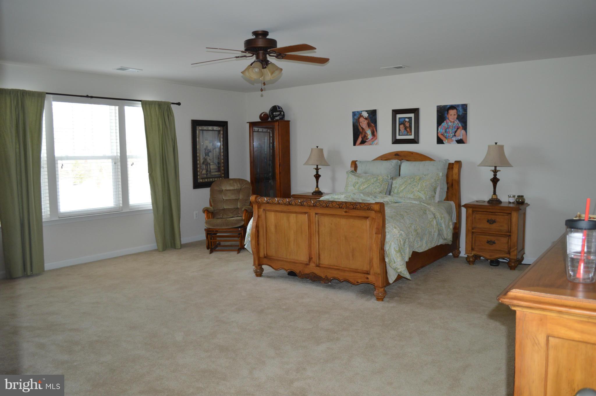 4229 Meyers Road Triangle, VA 22172 - Photo 13 of 29 a bedroom with bed and a large window