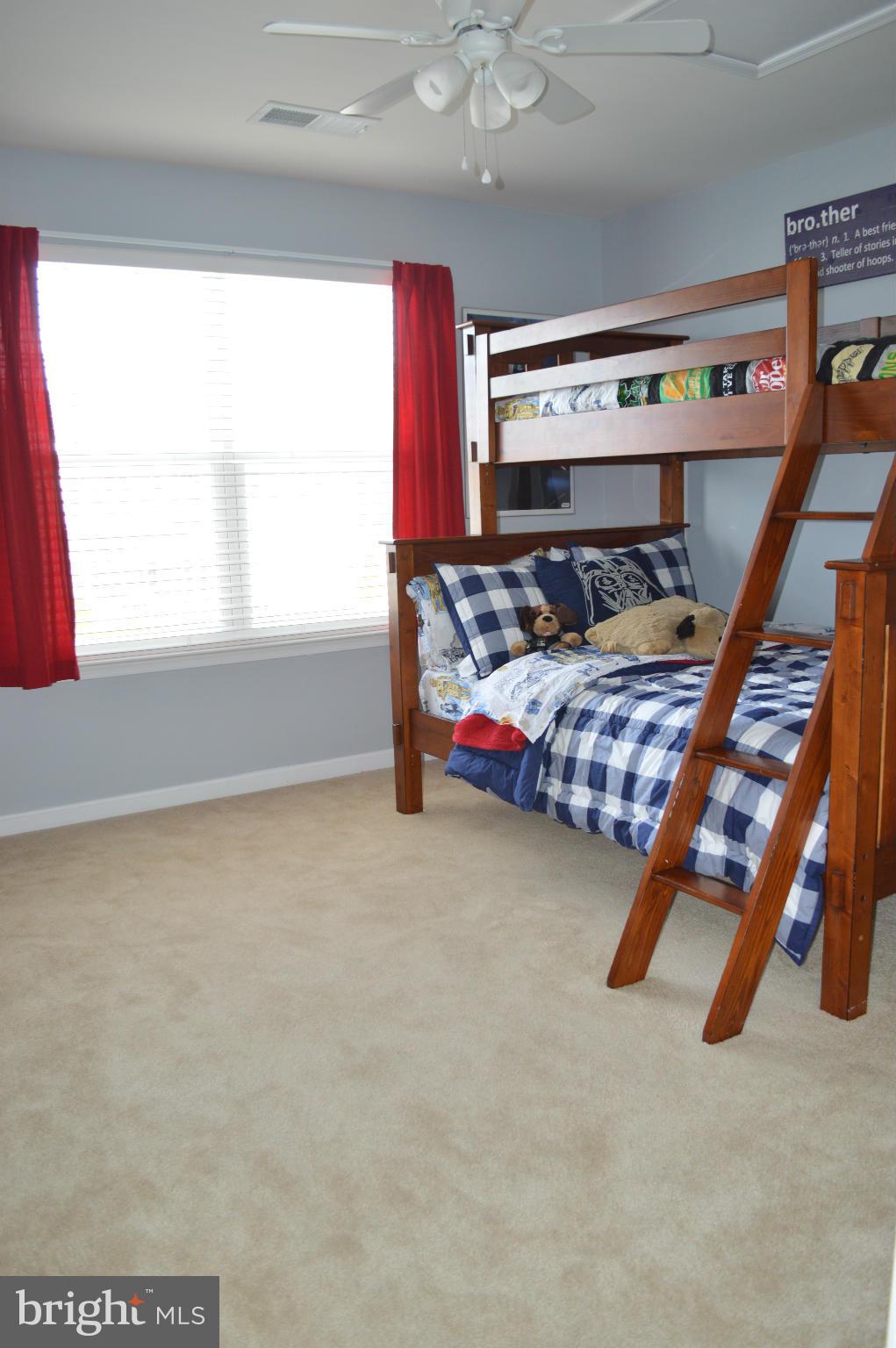 4229 Meyers Road Triangle, VA 22172 - Photo 17 of 29 a bedroom with furniture and window