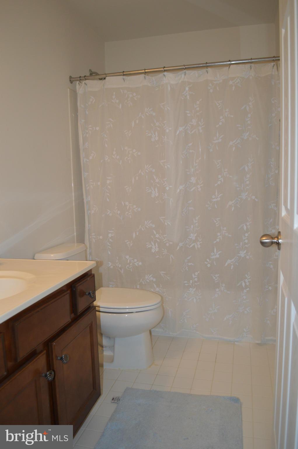 4229 Meyers Road Triangle, VA 22172 - Photo 22 of 29 a bathroom with a toilet a sink and shower