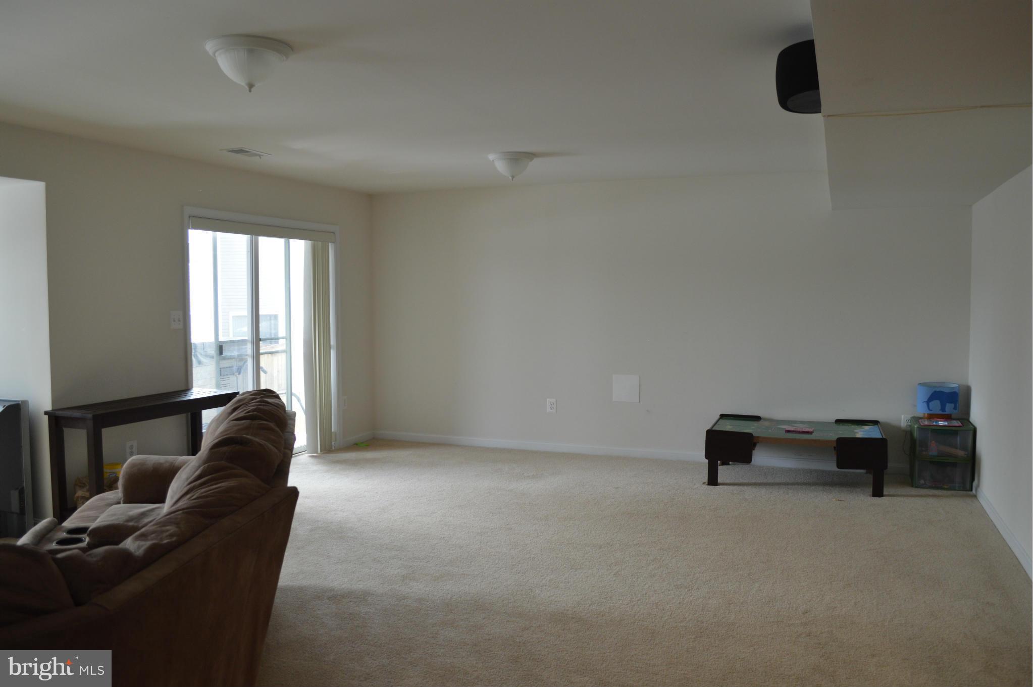 4229 Meyers Road Triangle, VA 22172 - Photo 25 of 29 a living room with furniture and a window