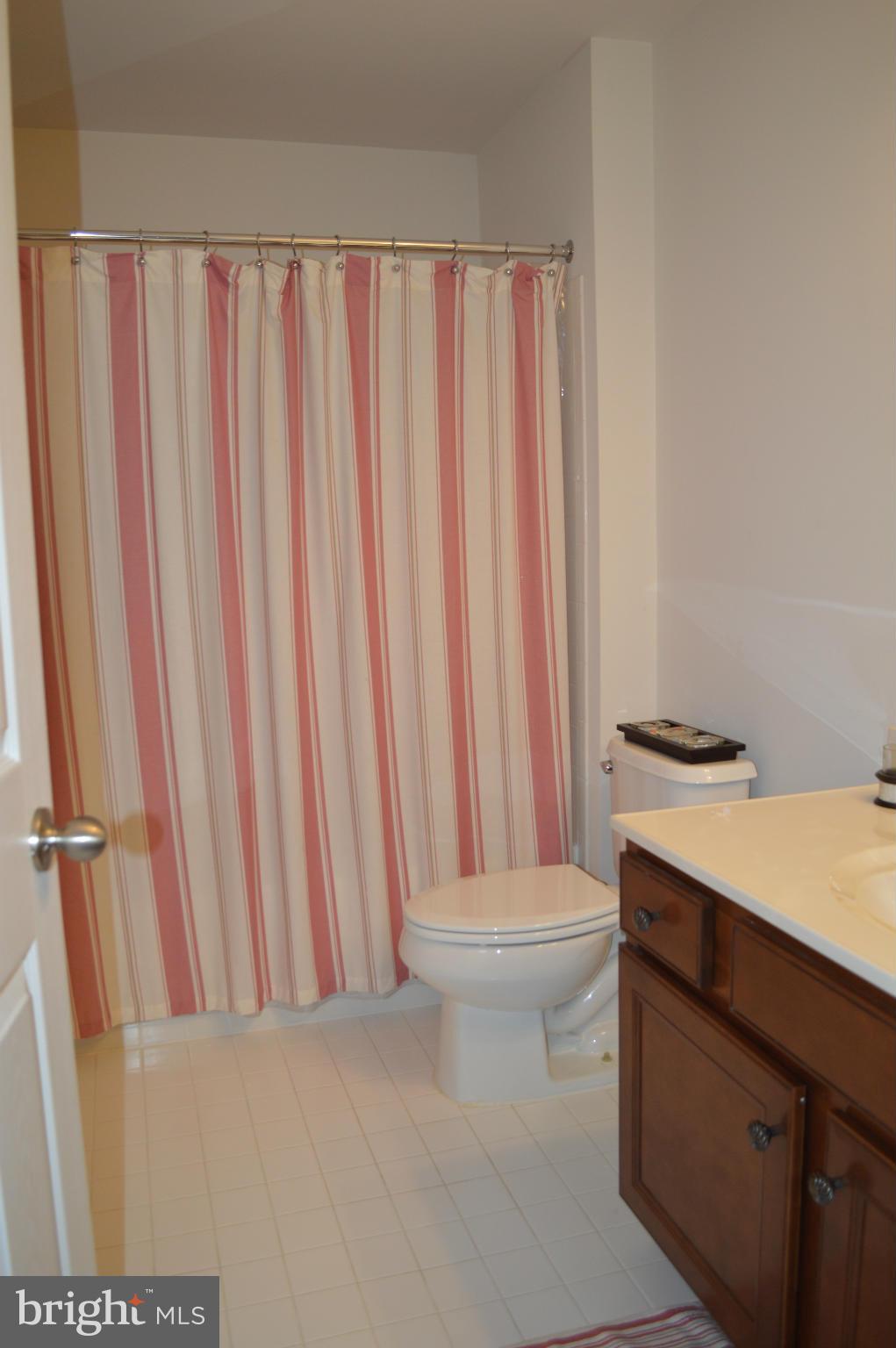 4229 Meyers Road Triangle, VA 22172 - Photo 26 of 29 a bathroom with a sink a toilet and a shower