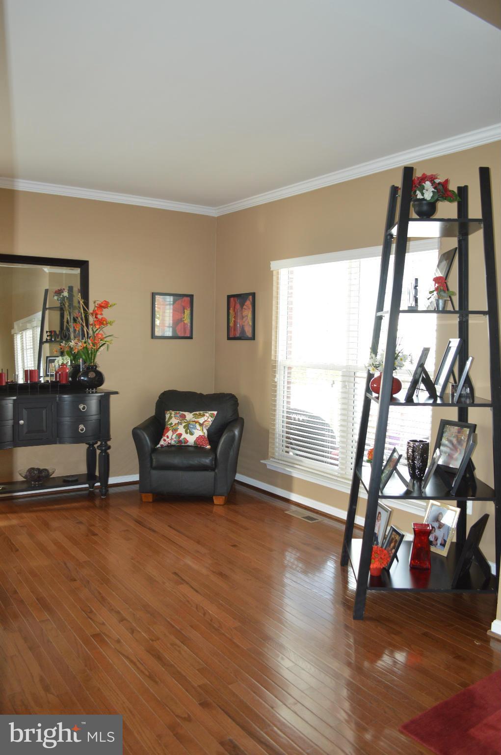 4229 Meyers Road Triangle, VA 22172 - Photo 4 of 29 a view of a room with wooden floor and windows