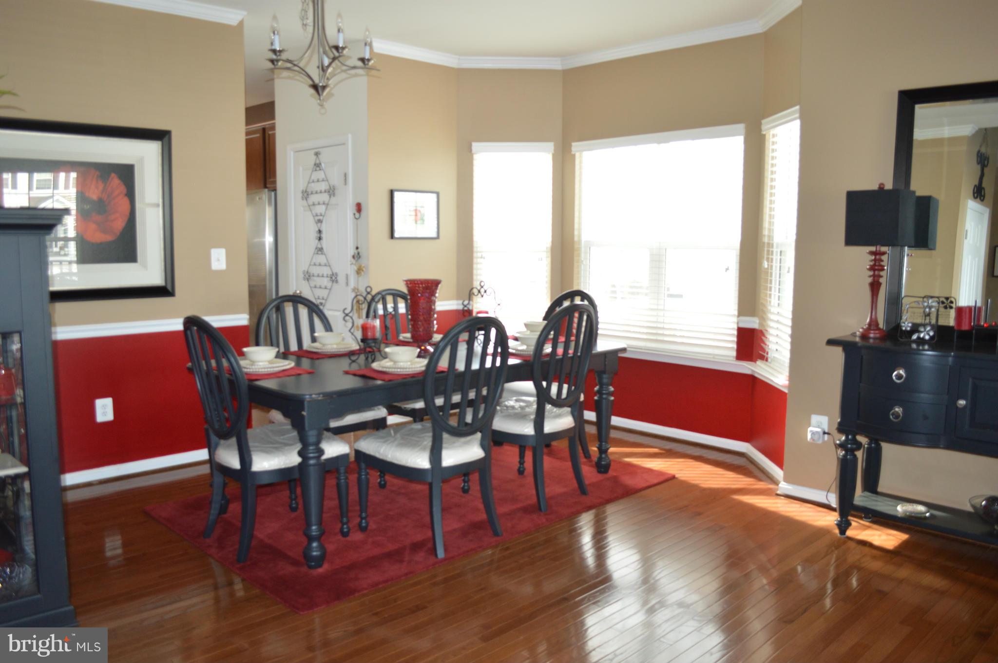 4229 Meyers Road Triangle, VA 22172 - Photo 5 of 29 a view of a dining room with furniture window and wooden floor