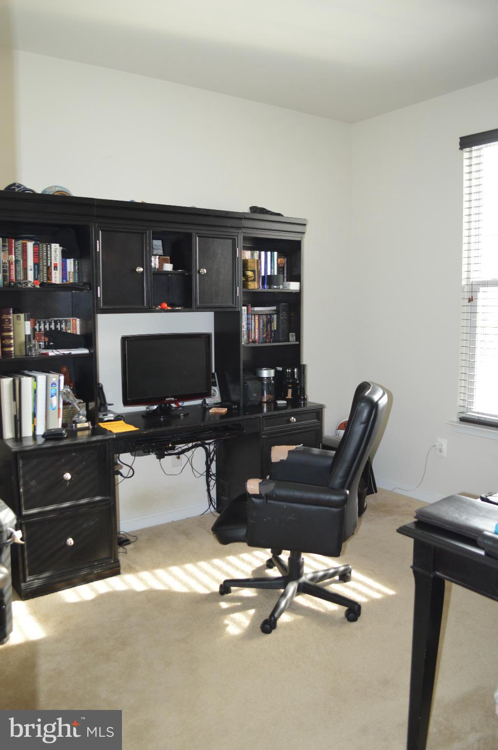 4229 Meyers Road Triangle, VA 22172 - Photo 10 of 29 a view of a workspace with furniture and a window