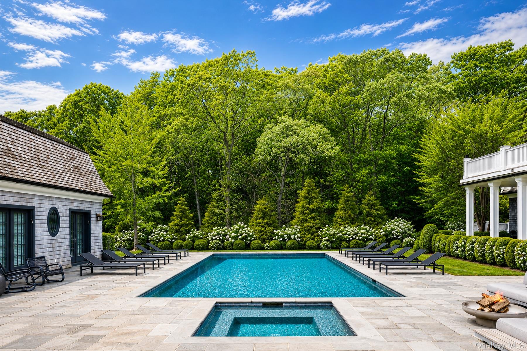 486 Middle Line Highway Bridgehampton, NY 11976 - Photo 2 of 28 a view of backyard with swimming pool and outdoor seating