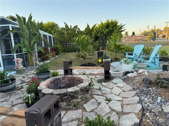 a view of a backyard with sitting area