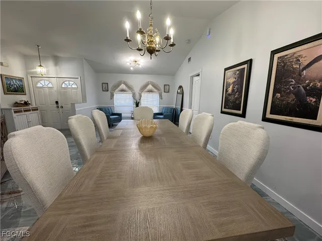 a living room with furniture and a large mirror