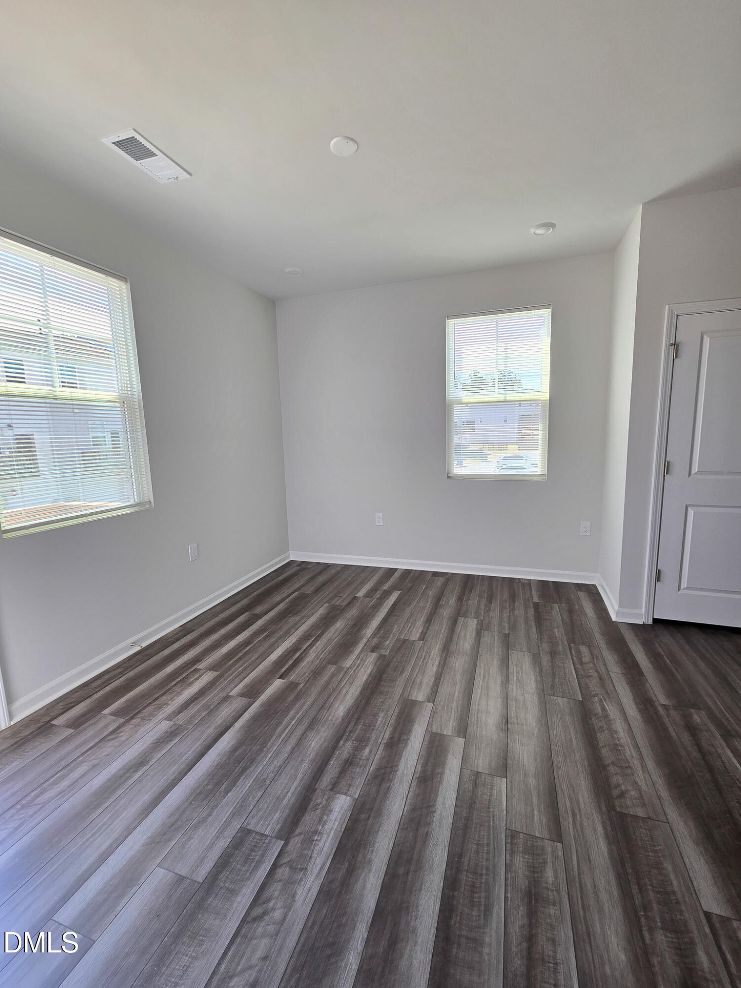 2431 Kasota Lane Raleigh, NC 27610 - Photo 22 of 46 a view of a room with wooden floor and window