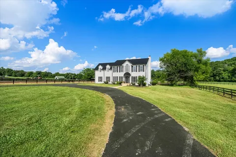 a view of a house with a big yard