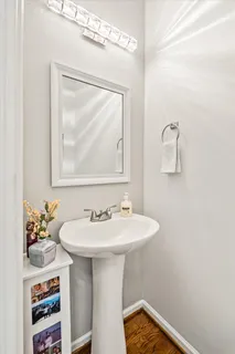 a kitchen with granite countertop a sink stove and refrigerator