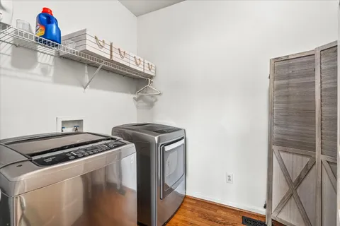 a en suite bathroom with a granite countertop sink and a mirror