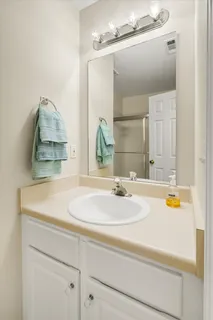 a view of a roof deck with table and chairs with wooden floor and fence