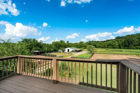 a view of a house with a yard and garage