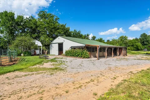a view of a yard with swimming pool
