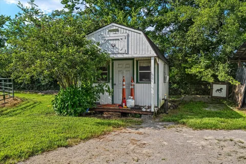 a view of a field with an ocean