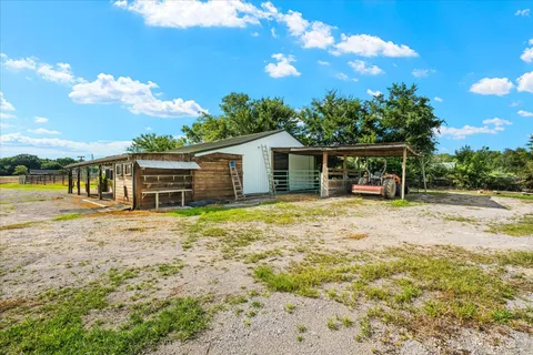 a view of a swimming pool with a yard